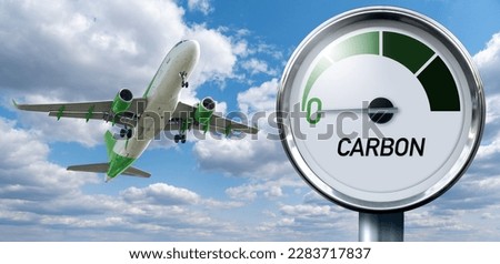 Gauge with inscription CARBON and arrow points to zero on a background of plane in sky. Concept of decarbonization and biofuel Royalty-Free Stock Photo #2283717837