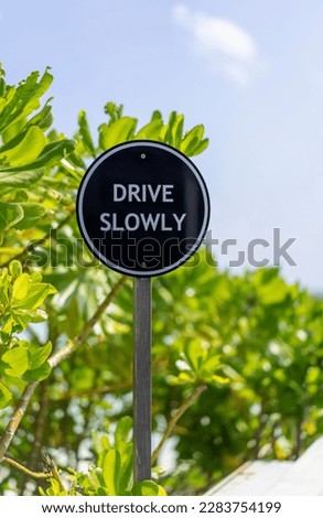 Sign Drive Slowly on a bridge at resort in he Maldives