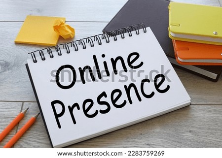 Online presence text written on a notepad with a spring