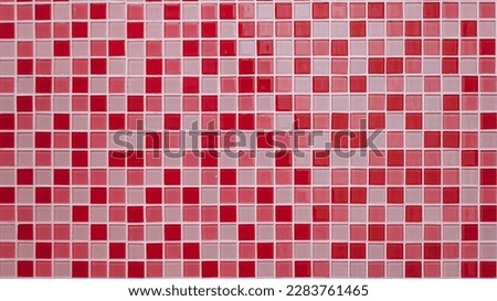 Mosaic wall background on ceramic with multiple color. Pink, white, and red.