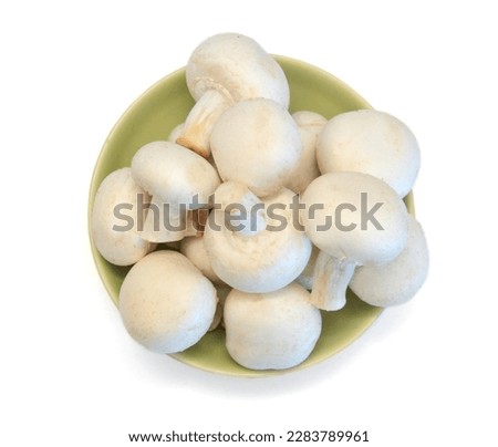 A sections of mushroom in bowl on white
