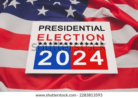 Politics and voting concept. Presidential election 2024 text on white paper over the American flag background Royalty-Free Stock Photo #2283813593