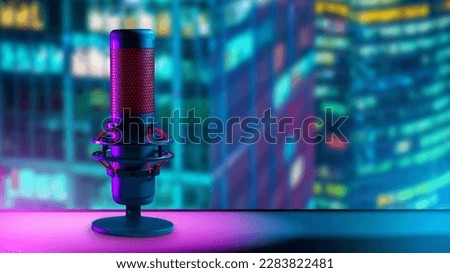 Professional microphone on table. Microphone for recording radio podcast. Device for conducting audio broadcasting. Microphone in recording studio. Micro near blurred skyscrapers. Broadcasting studio
