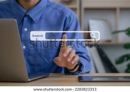Searching Browsing Internet Data Information Networking Concept.Businessman working with tablet and laptop computer with blank search bar icon.