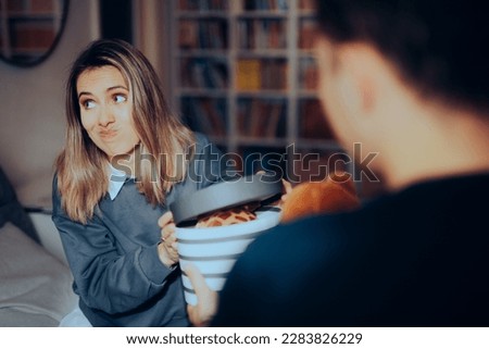 
Girlfriend Refusing a Gift from her Partner on Valentine’s Day. Embarrassed girl feeling ashamed to refuse unwanted present
 Royalty-Free Stock Photo #2283826229