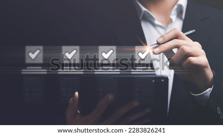 operator makes mark on survey topic ,Auditing and evaluating quality and efficiency of personnel ,Checklist with checkmarks and checkboxes ,online quality assessment ,Qualification for Measurement Royalty-Free Stock Photo #2283826241