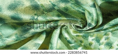 silk fabric in African style green and white. For designer, texture pattern, background collection.