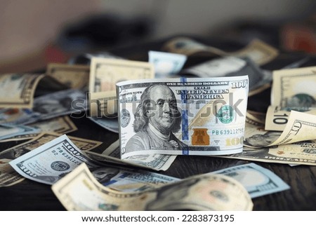 Money, US dollar bills background. Money scattered on the desk. Photography for Finance concepts. 