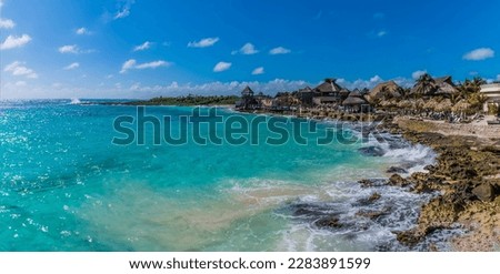 A view across the rocky shoreline at the mexican resort of Costa Maya on the Yucatan peninsula on a sunny day Royalty-Free Stock Photo #2283891599