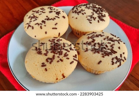 Cupcake with meses topping on a white plate. Small snack suitable for breaking the fast 

