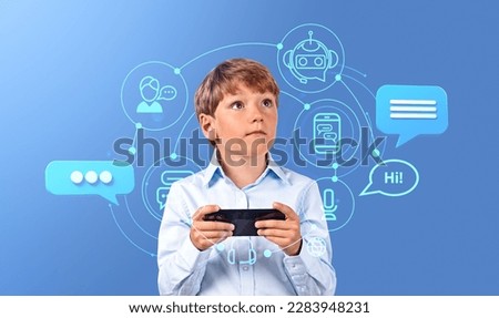 Portrait of little boy holding smartphone over blue background with immersive AI interface. Concept of artificial intelligence and machine learning