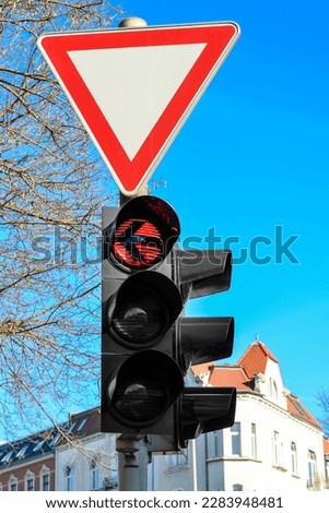 View of traffic lights with Yield sign in city, closeup
