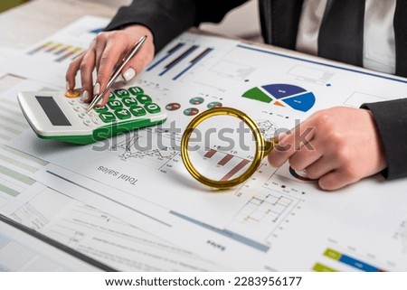 Business woman doing analytic research graph and business plan investment. Economic business concept