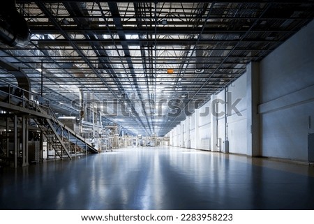 Large factory workshop space building Royalty-Free Stock Photo #2283958223