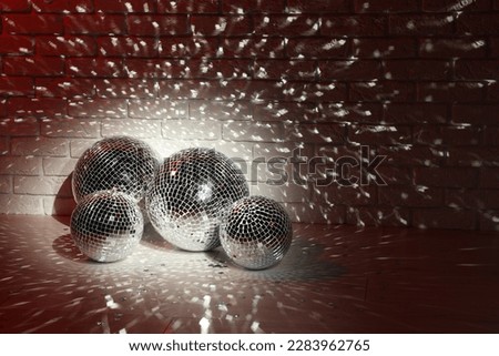 Many shiny disco balls indoors, color toned. Space for text Royalty-Free Stock Photo #2283962765