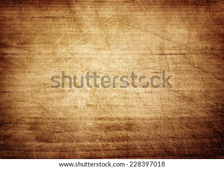 Dark scratched grunge cutting board. Wooden texture. Royalty-Free Stock Photo #228397018