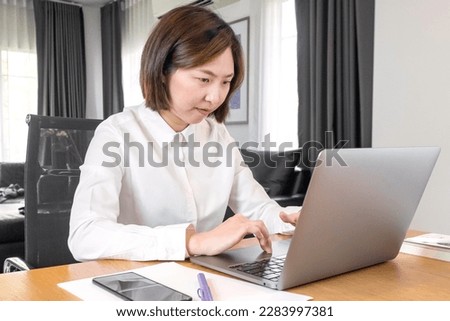 Young woman using laptop working at home office, business online, meeting, seminar, video call for online meeting with office.