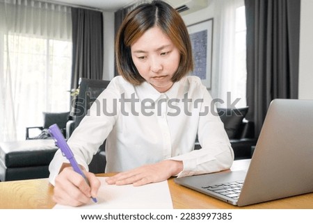 Young woman using laptop working at home office, business online, meeting, seminar, video call for online meeting with office.