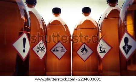 Warning symbol for chemical hazard on chemical container, chemical in laboratory and industry 