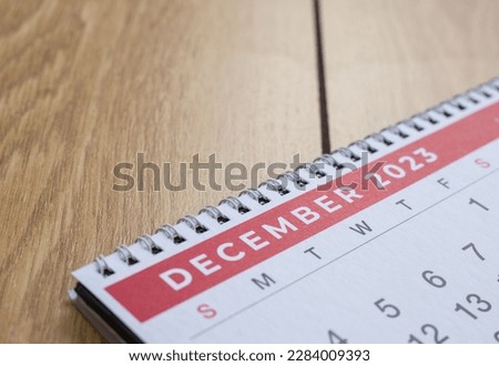Closeup shot of a 2023 calendar, "December page". Selective focus shot of a calendar, focused on "December, 2023". Royalty-Free Stock Photo #2284009393