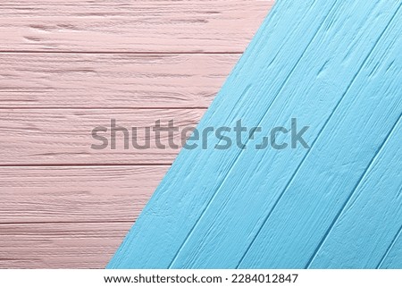 Texture of pink and light blue wooden surfaces as background, top view