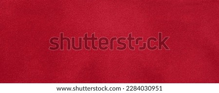 Dark red matte background of suede fabric, closeup. Velvet texture of seamless wine leather. Felt material macro. Royalty-Free Stock Photo #2284030951
