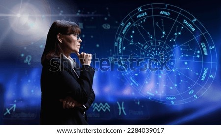 Woman interested in astrology, universe stars astrological wheel background