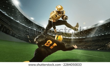 Two men, professional american football, soccer players in uniform during match playing at open air 3D stadium with flashlights and blurred stands. Concept of sport, competition, game, championship