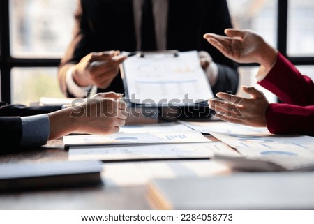 The sales department is having a monthly summary meeting to bring it to the department manager, they are verifying the correctness of the documents that are prepared before bringing in to the manager
