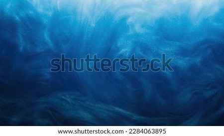 Shimmering fluid. Ink water. Sparkling wave. Magic blizzard. Blue color glowing glossy smoke cloud dust texture abstract art background.