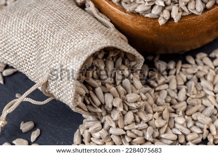 Sunflower seeds peeled from the black shell, scattered sunflower seeds peeled from the shell