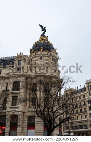 Metropolitan building with great architecture located at the entrance of Madrid gran via Royalty-Free Stock Photo #2284091269