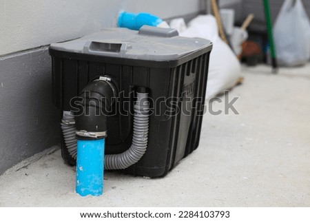 Grease traps box outside the house, water treatment. Royalty-Free Stock Photo #2284103793