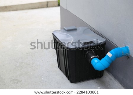 Grease traps box outside the house, water treatment. Royalty-Free Stock Photo #2284103801