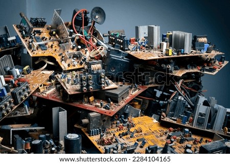 Pile of electronic circuit boards garbage in room from recycle industry, used electronic waste. Royalty-Free Stock Photo #2284104165
