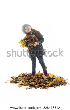 Little girl on autumn leaf