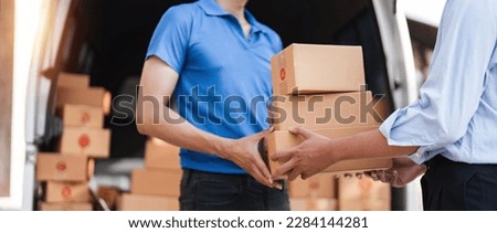Home delivery service and working service mind. Man customer hand receiving a cardboard boxes parcel from delivery service courier. delivery logistic concept Royalty-Free Stock Photo #2284144281