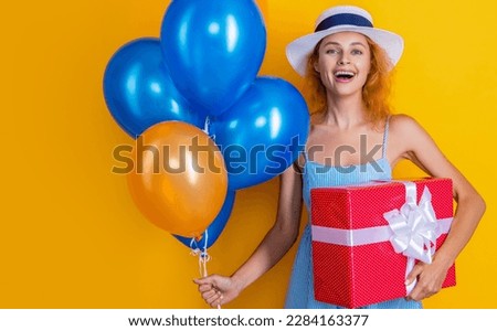 birthday woman with present isolated on yellow, advertisement. birthday woman