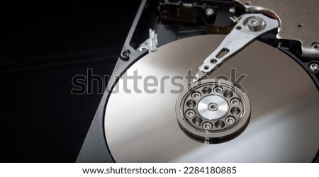 Internal parts of the hard drive. HDD. Computer memory. Modern technologies. Computer repair. Data storage concept. Black background. Free space for text. Recover lost data. Royalty-Free Stock Photo #2284180885