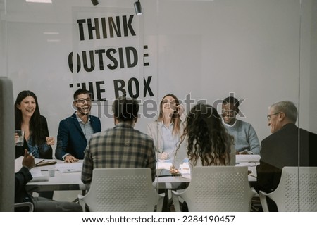 Happy friendly multiracial team working together, talking and having fun moments during stuff meeting Royalty-Free Stock Photo #2284190457