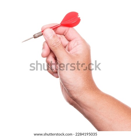 Hand holding red dart isolated on white background