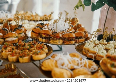 table with snacks, catering for a wedding, white color Royalty-Free Stock Photo #2284201677