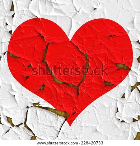 Red heart as old foil on the wood structure, good image for a broken heart, love, romance and Valentine themes. 
