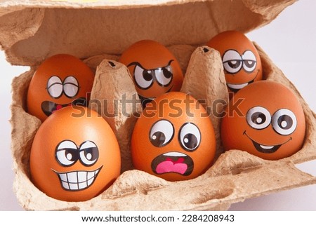 Funny brown easter eggs in box