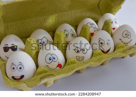 Funny white easter eggs in box