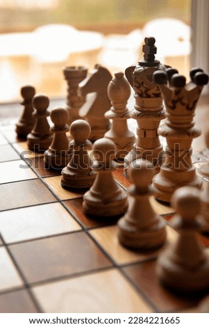 chess board. Chess set on the chess board. chess game pieces. Logical tactical turn based game, tournament, sport, game, hobby and interests, highly intellectual occupation. classical. wooden board.