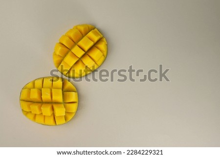 juicy healthy fresh tropical mango rich in vitamins on a light beige background. for screensavers postcards covers signs inscriptions banners and much more