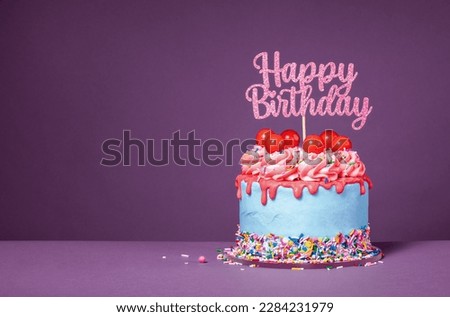 Fun happy birthday drip cake over a purple background