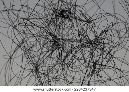Tangled strings, dramatic view, the  concepts, in silhouettes, backgrounds. Royalty-Free Stock Photo #2284237347