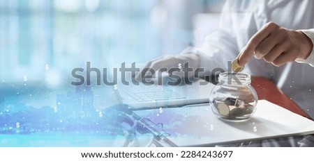 Doctor collects coins as savings during medical insurance. Royalty-Free Stock Photo #2284243697